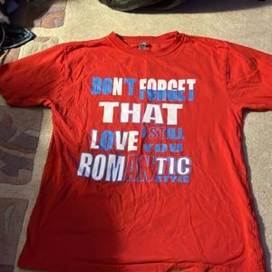 Red shirt with white and blue words size large girls/boys